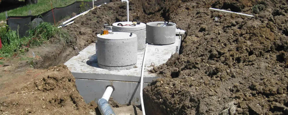 Septic system repair and installation site with tank access ports in Denver, CO