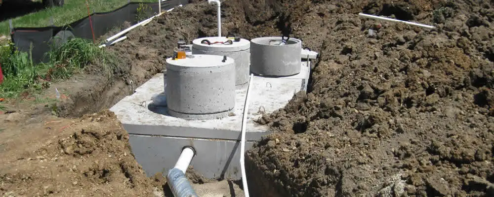 Septic system repair and installation site with tank access ports in Denver, CO